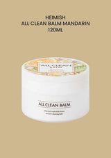 HEIMISH All Clean Balm Mandarin 120ml jar on a sand background.