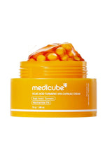 Orange jar of Medicube cream with visible contents on a white background
