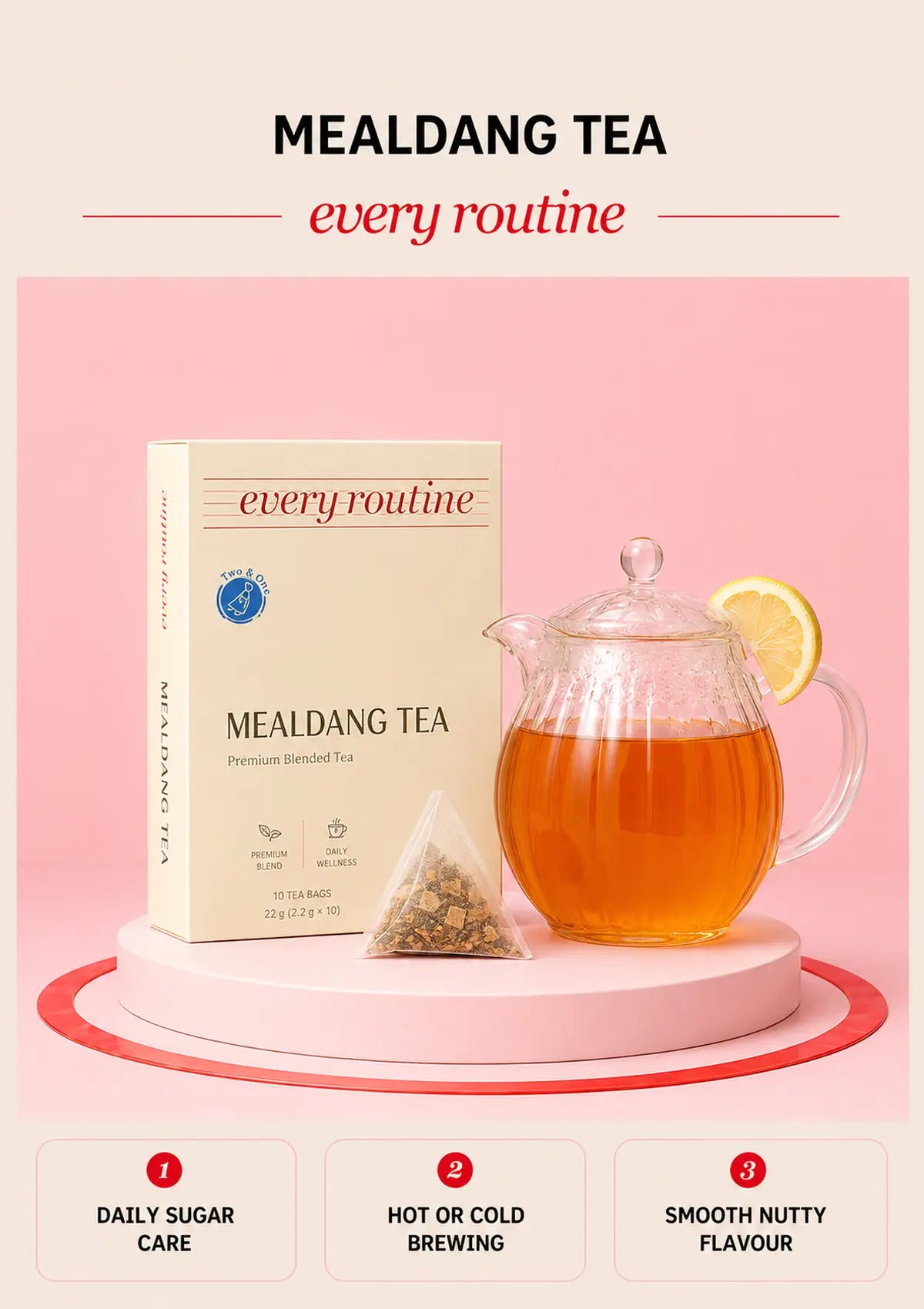 Every Routine Mealdang Tea box with glass teapot, amber tea and triangular tea bag on a pink podium