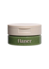 Green container with beige lid on a white background, featuring the brand 'flaner'.