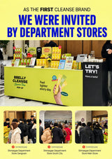 Promotional graphic for BBELBY CLEANSE featuring a large yellow header with blue text, a central photo of a branded pop-up display counter in a store, and three smaller photos of customers at the counter. The products shown are yellow and green squeeze bottles and boxes.