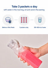 An infographic-style product image showing a clear bottle being held by a hand, filled with pink powder or liquid, with text above explaining daily packet usage and water intake. The top half is blue-and-white instructional content, and the bottom half shows the bottle in use against a light neutral background.