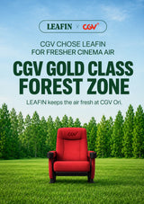 A promotional graphic for the LEAFIN x CGV Forest Zone cinema seat, featuring a red upholstered movie chair with black armrests set against a lush green forest and grass background under a blue sky. Large text reads 'CGV GOLD CLASS FOREST ZONE' with LEAFIN and CGV branding at the top.