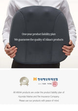 Person holding a gray seat cushion with text about Aikaa's product liability plan on a white background.