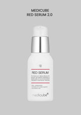 Medicube Red Serum 2.0 bottle on a gray background