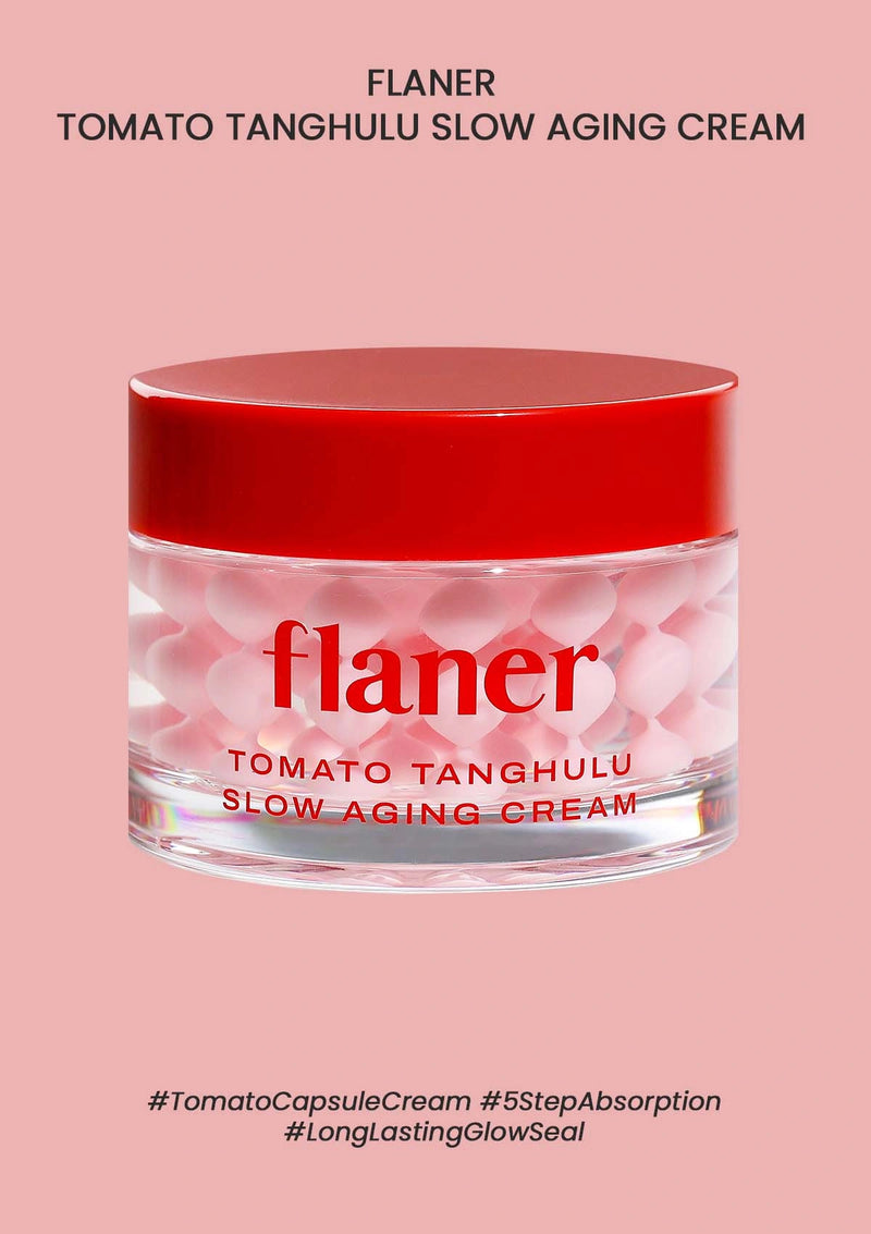 Flaner Tomato Tanghulu Slow Aging Cream jar with red lid on a pink background