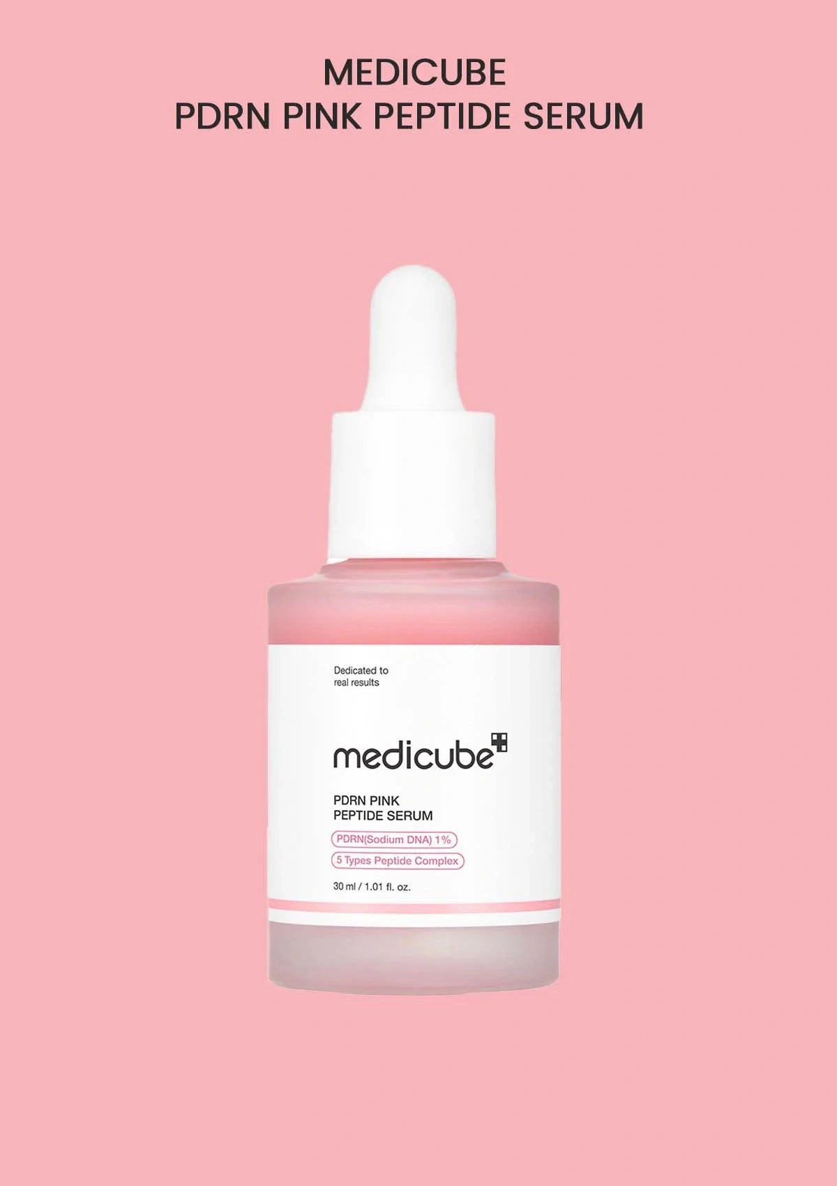 Medicube PDRN Pink Peptide Serum bottle on a pink background