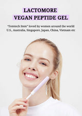 A smiling woman with a pale, glowing face holds a lavender and white cosmetic tube against a light gray background. Text at the top reads 'LACTOMORE VEGAN PEPTIDE GEL' with additional promotional copy below.