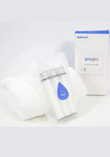 BODYLUV Puresome replacement filter cartridge beside its white and blue box and a folded towel.