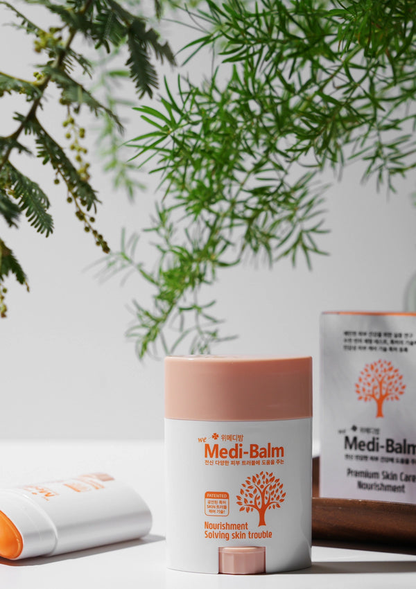 Medi-Balm skincare product with green leaves in the background