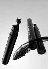 Black makeup brush with visible brand name on a white background