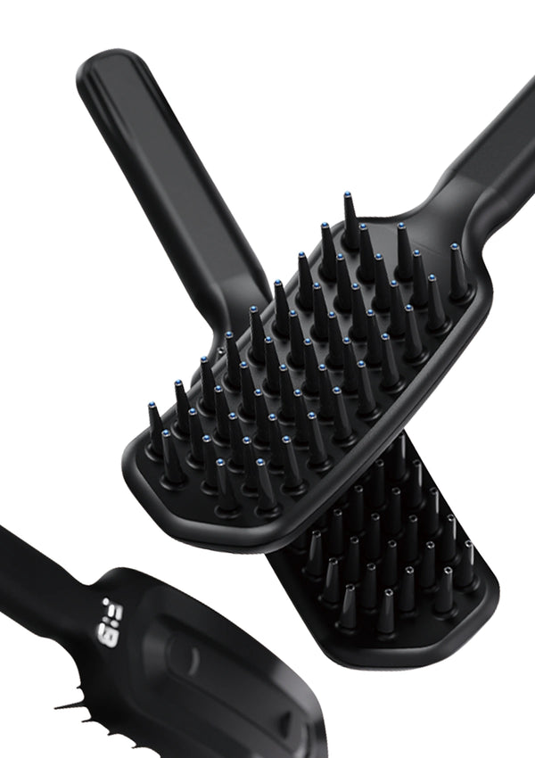 Black hairbrush with bristle design on a white background