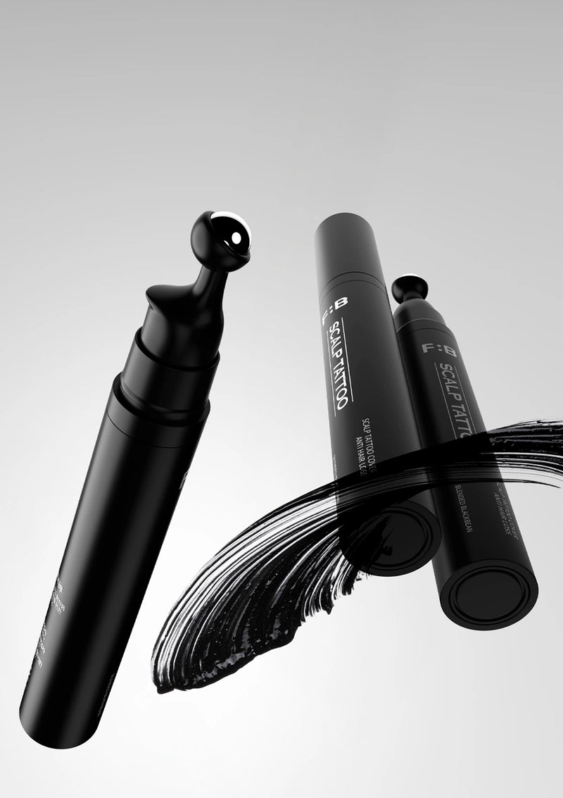 Black makeup brush with visible brand name on a white background