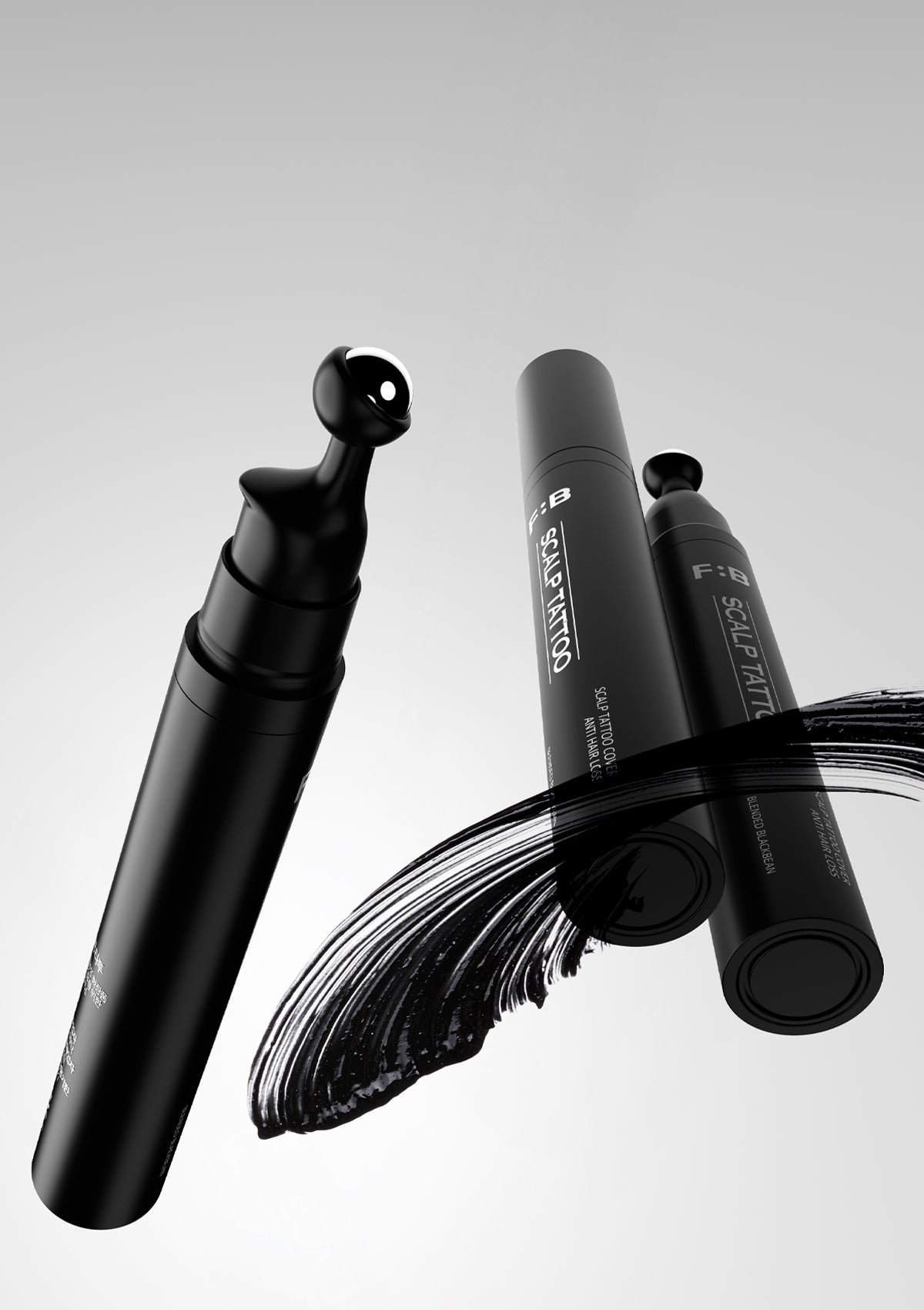 Black makeup brush with visible brand name on a gray background
