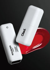 Two white containers labeled 'Oliad' and 'Rougher' on a black background with a red heart shape.