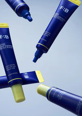 F:B hair care product tubes on a light blue background