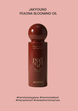 Red bottle of Jakyoung Peaona Blooming Oil on a pink background