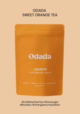 Odada sweet orange tea package on a beige background