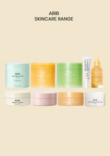 ABIB Skincare Range collection featuring eight products in various pastel and vibrant shades, including creams, serums, and masks, arranged neatly on a solid beige background.