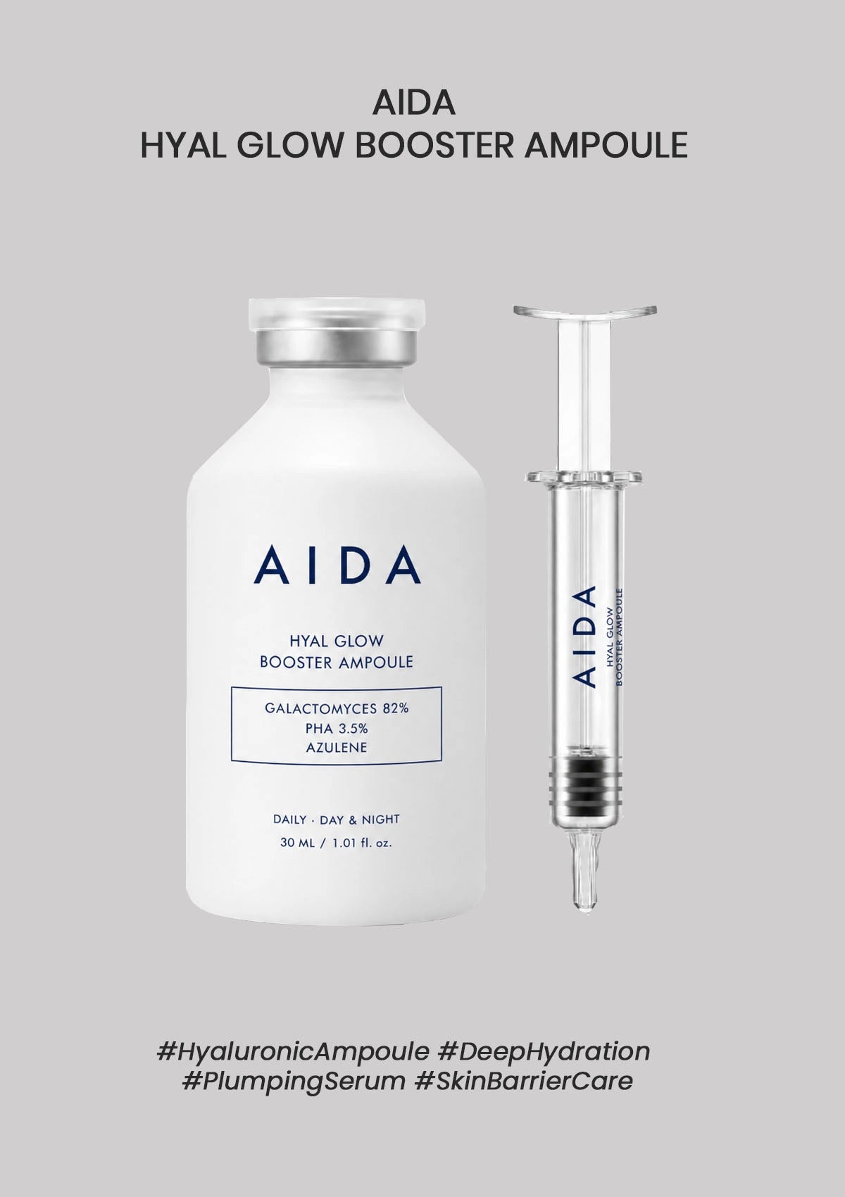 AIDA Hyal Glow Booster Ampoule with syringe on a gray background