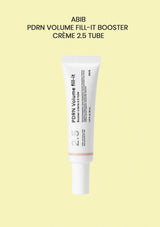 A white cosmetic tube labeled 'PDRN Volume fill-it' with a small pale pink band near the bottom, centered on a pale yellow background. Text above reads 'ABIB PDRN VOLUME FILL-IT BOOSTER CRÈME 2.