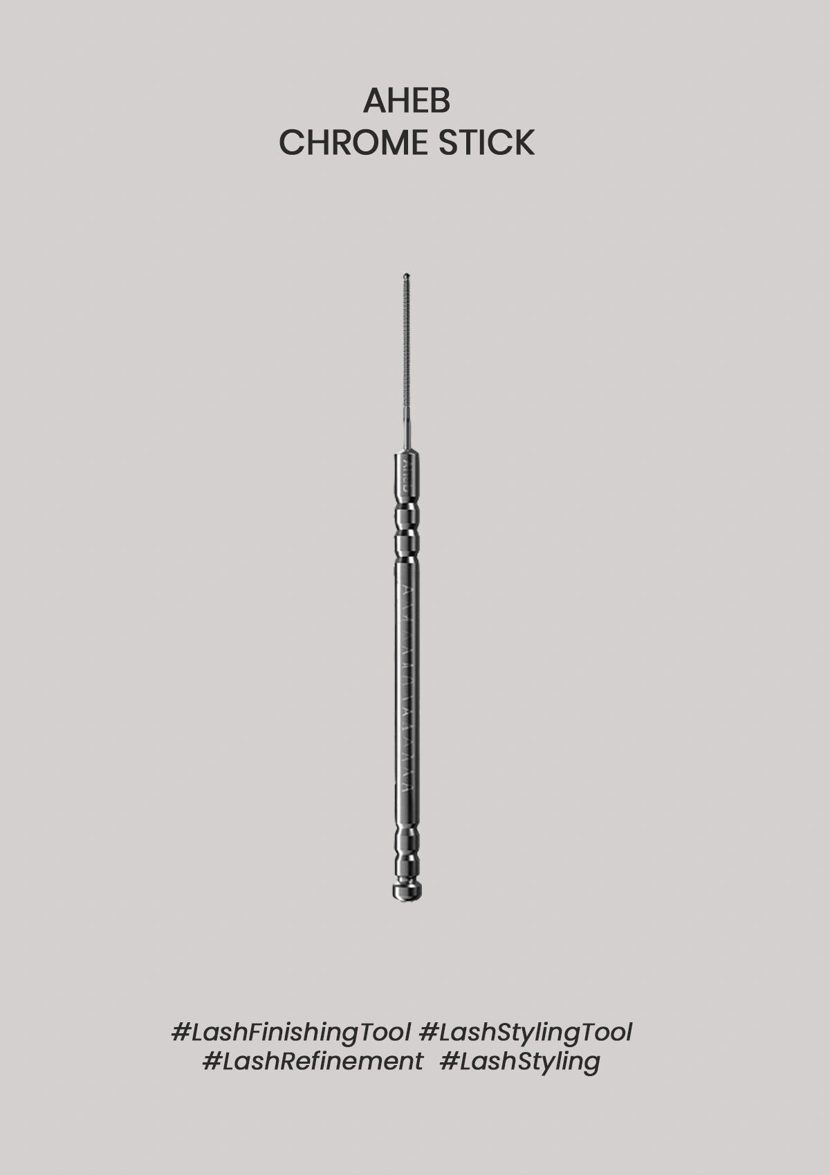 A single slim metallic lash styling tool is centered on a plain light gray background, with the text 'AHEB CHROME STICK' above it and hashtag-style labels below.
