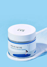Skincare jar with a blue background