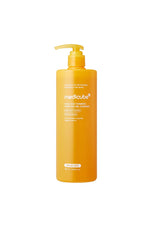 A tall, cylindrical orange-yellow pump bottle of medlcube Hair Acid Turmeric Deep Pore-Cleansing Milk on a solid white background.