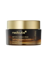 Medicube Deep Vita C Capsule Cream jar with gold lid on a white background